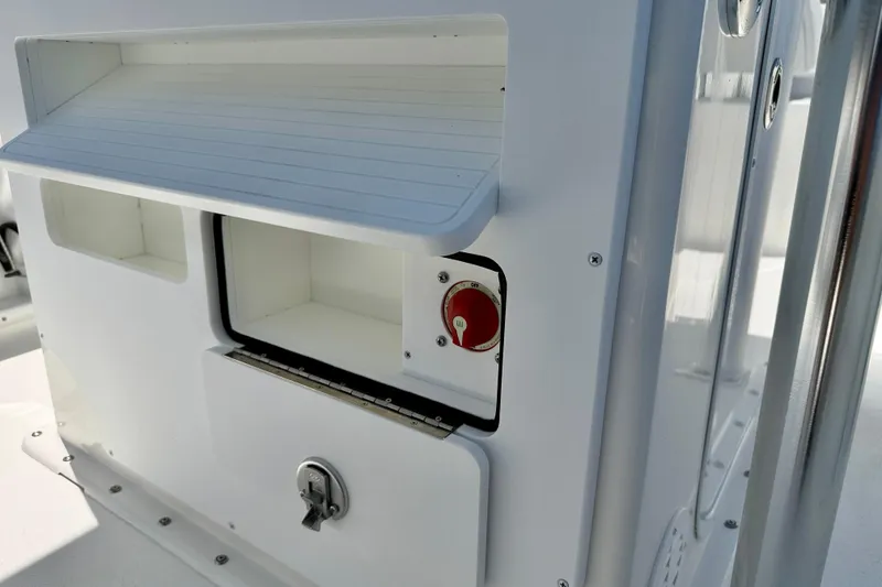 Slide: The Image of 2026 Bay Rider 21 Offshore boat storage compartments and control panel. - 31