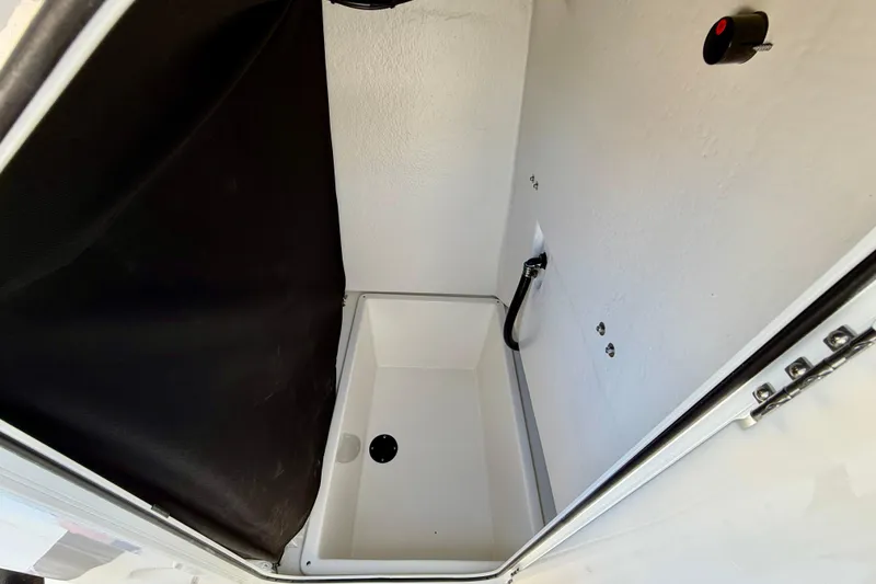 Slide: The Image of Interior compartment of 2026 Bay Rider 21 Offshore boat, featuring storage space. - 33