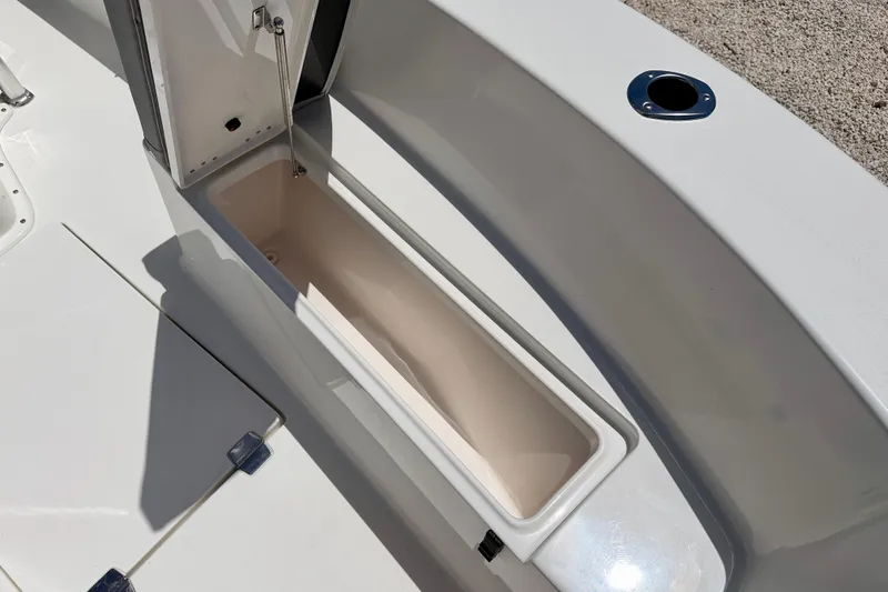 Slide: The Image of Open storage compartment on 2026 Bay Rider 21 Offshore boat deck. - 34