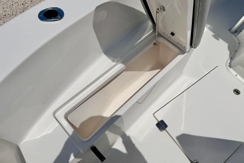 Slide: The Image of Bay Rider 21 Offshore 2026 boat storage compartment with open hatch, showcasing sleek design. - 35