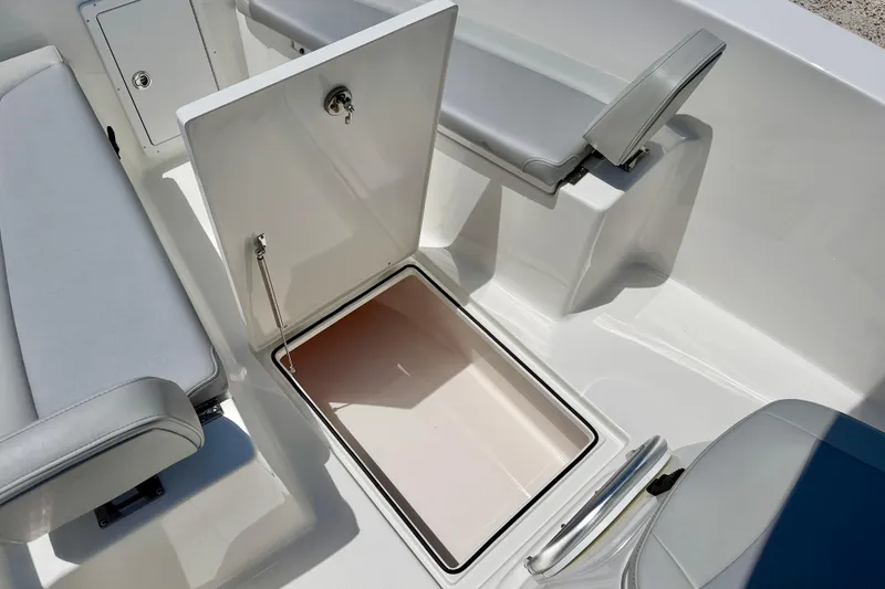 Slide: The Image of 2026 Bay Rider 21 Offshore boat interior with open storage compartment and seating. - 36