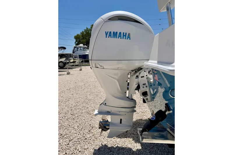 Slide: The Image of Yamaha outboard motor on 2026 Bay Rider 21 Offshore boat, parked on gravel. - 41