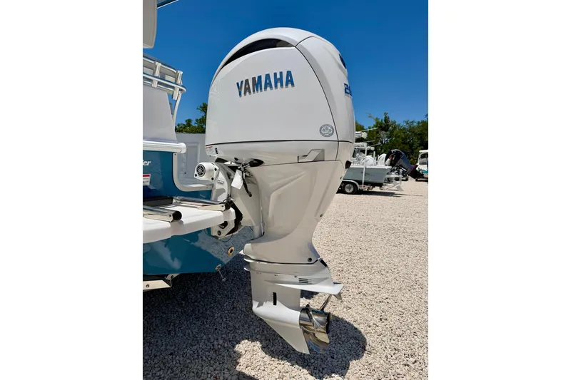 Slide: The Image of Bay Rider 21 Offshore 2026 with Yamaha outboard motor in a sunny outdoor setting. - 42