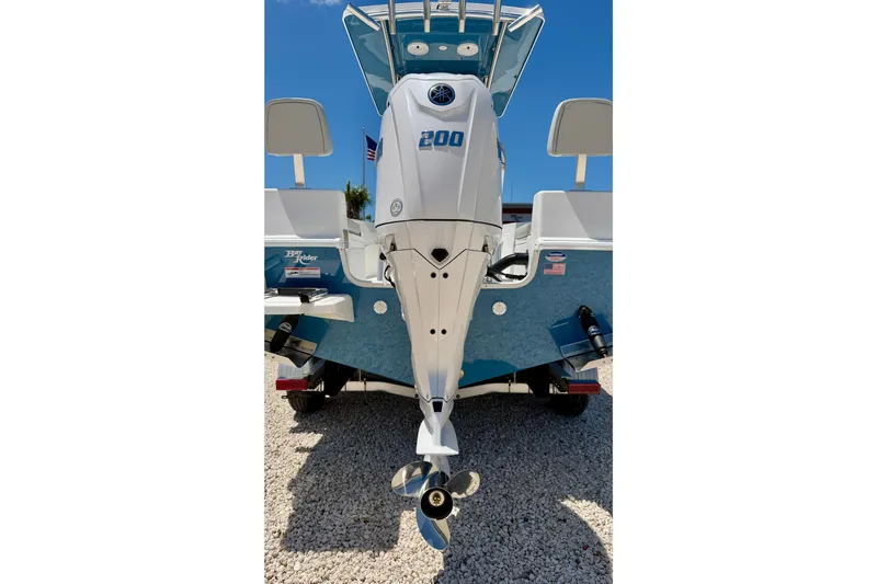 Slide: The Image of 2026 Bay Rider 21 Offshore boat with powerful outboard motor, displayed on gravel. - 43