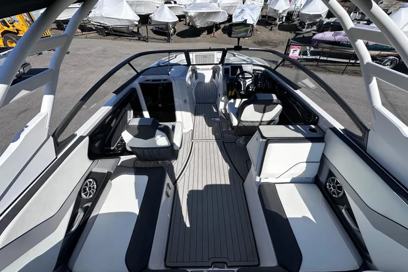 Slide: The Image of 2021 Yamaha Boats 252S interior, featuring sleek seating and modern dashboard design. - 14