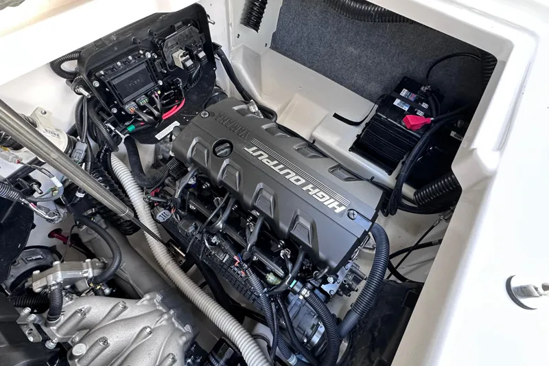 Slide: The Image of Engine compartment of a 2021 Yamaha Boats 252S, showcasing the high-output engine. - 21