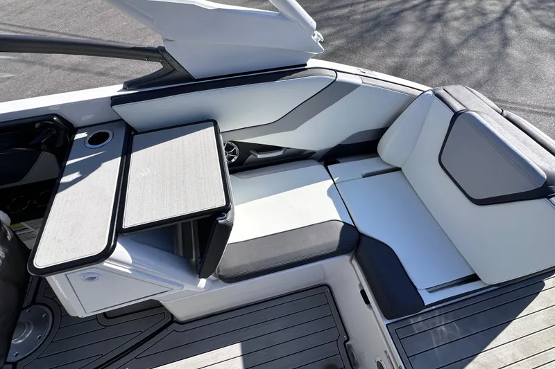 Slide: The Image of 2021 Yamaha Boats 252S interior with seating and table setup. - 25