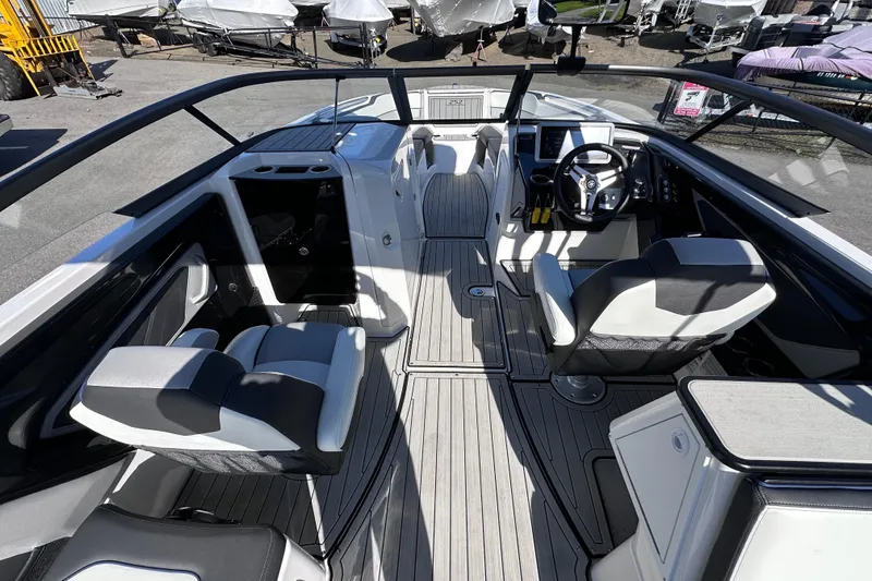 Slide: The Image of Interior view of 2021 Yamaha Boats 252S, featuring sleek seating and modern dashboard. - 29