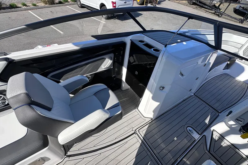 Slide: The Image of 2021 Yamaha Boats 252S interior with sleek seating and modern dashboard design. - 30