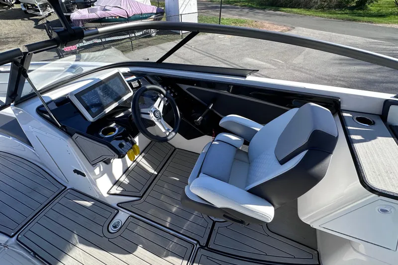 Slide: The Image of 2021 Yamaha Boats 252S cockpit with modern steering and navigation system. - 34