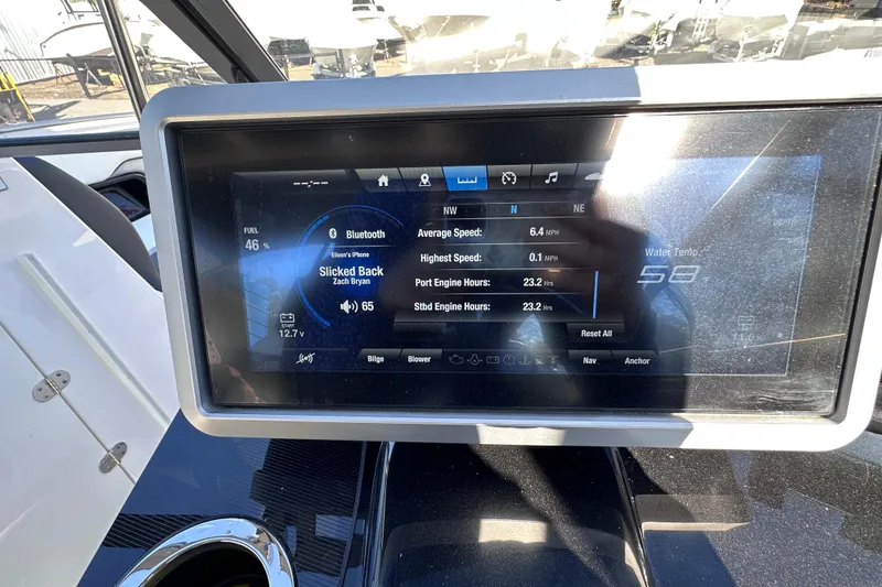 Slide: The Image of Dashboard of 2021 Yamaha Boats 252S displaying speed, fuel, and music information. - 37
