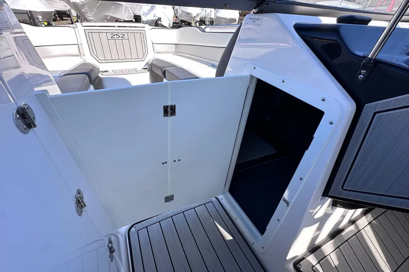 Slide: The Image of 2021 Yamaha Boats 252S interior with open storage compartment and seating area. - 39