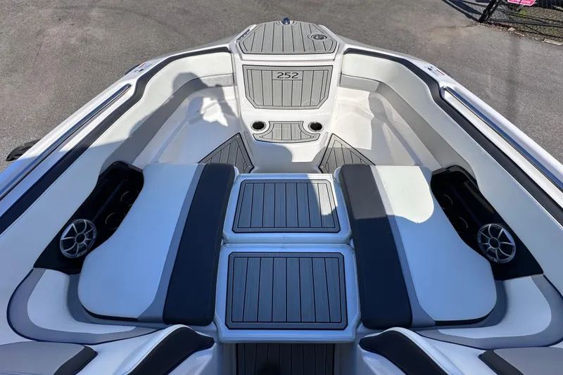 Slide: The Image of 2021 Yamaha Boats 252S interior with seating and cup holders, showcasing modern design. - 41