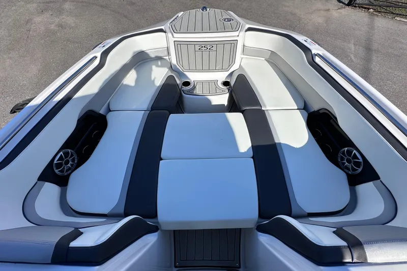 Slide: The Image of 2021 Yamaha Boats 252S interior with sleek seating and integrated speakers. - 42