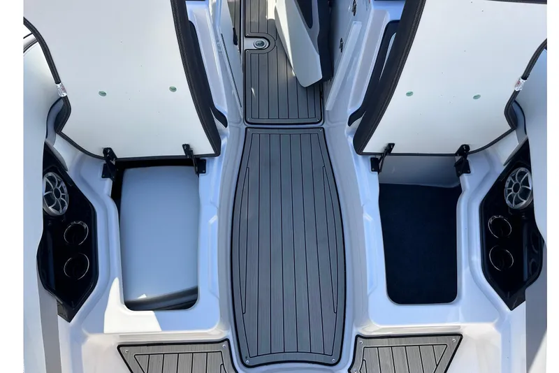 Slide: The Image of 2021 Yamaha Boats 252S interior with open storage compartments and sleek flooring design. - 44