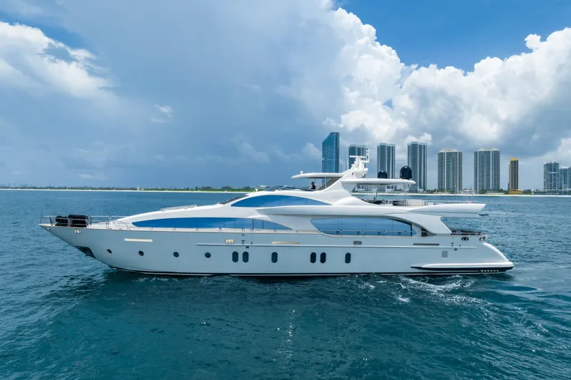 Slide: The Image of Luxurious 2012 Azimut yacht cruising near city skyline under cloudy sky. - 14
