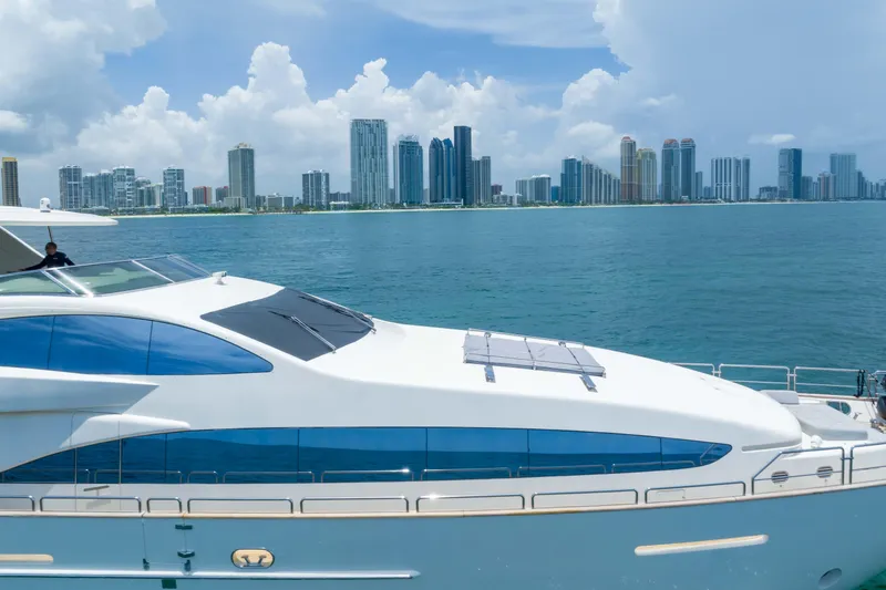 Slide: The Image of Luxurious 2012 Azimut yacht cruising near a city skyline under a cloudy sky. - 19