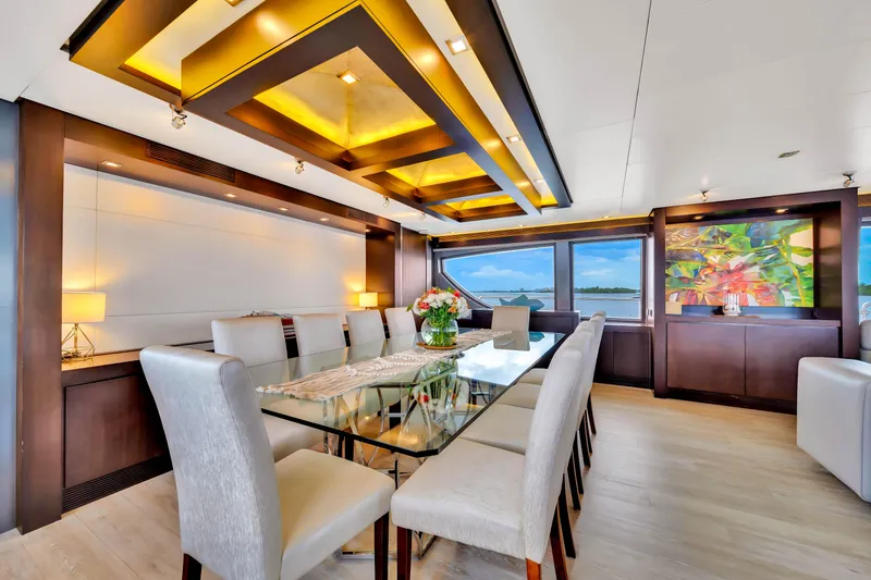 Slide: The Image of Luxurious dining area on a 2012 Azimut yacht with elegant decor and panoramic views. - 31