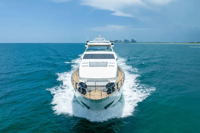 Slide: The Image of Luxurious 2012 Azimut yacht cruising on open blue sea near city skyline. - 4