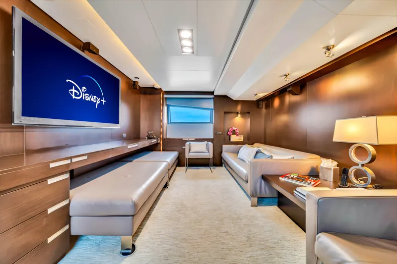Slide: The Image of Luxurious 2012 Azimut yacht interior with modern decor and Disney+ on TV screen. - 44