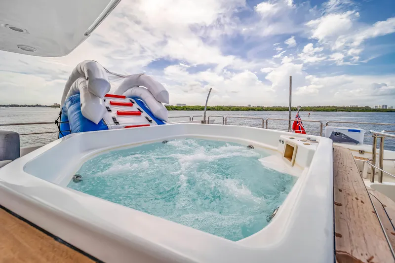 Slide: The Image of Luxurious Azimut yacht with jacuzzi and inflatable slide, 2012 model, on serene water. - 47