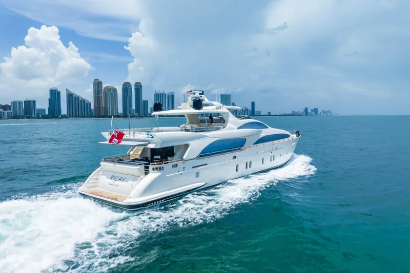 Slide: The Image of Luxurious 2012 Azimut yacht cruising near a city skyline on a sunny day. - 5