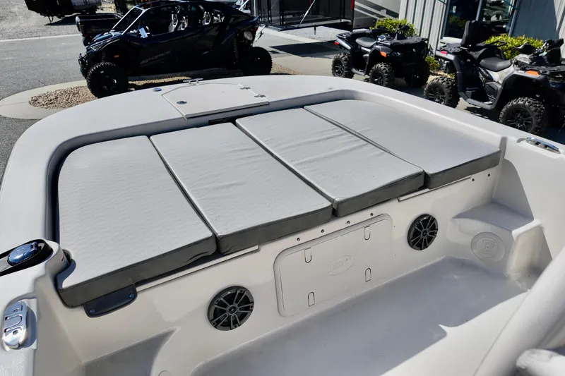 Slide: The Image of 2026 Carolina Skiff 21 LS boat interior with cushioned seating and storage compartments. - 10