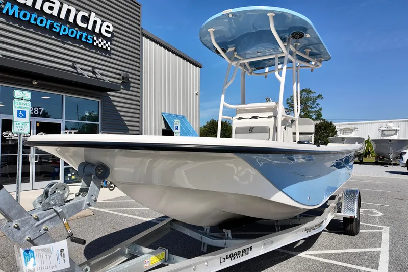 Slide: The Image of 2026 Carolina Skiff 21 LS boat on trailer at dealership. - 3