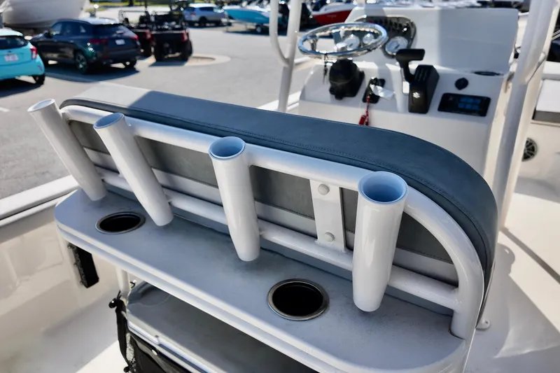 Slide: The Image of 2026 Carolina Skiff 21 LS boat interior with rod holders and steering console. - 6