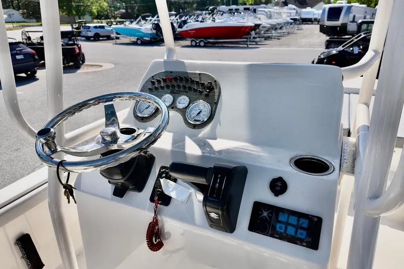 Slide: The Image of Steering console of a 2026 Carolina Skiff 21 LS boat, featuring gauges and controls. - 7