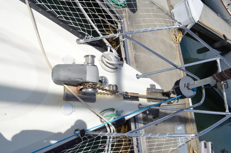 Slide: The Image of 1980 Cooper 416 Pilothouse yacht deck with anchor chain and winch system. - 11