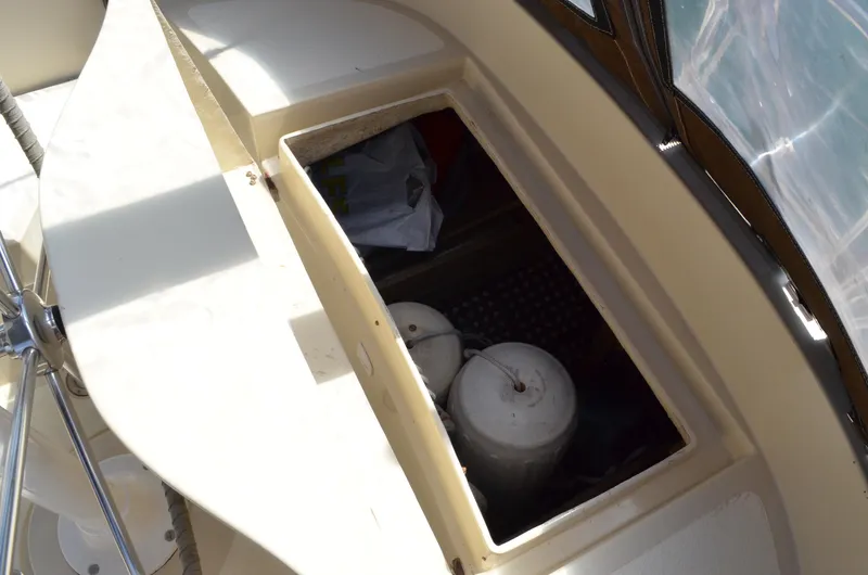 Slide: The Image of Open storage compartment on 1980 Cooper 416 Pilothouse boat deck. - 20