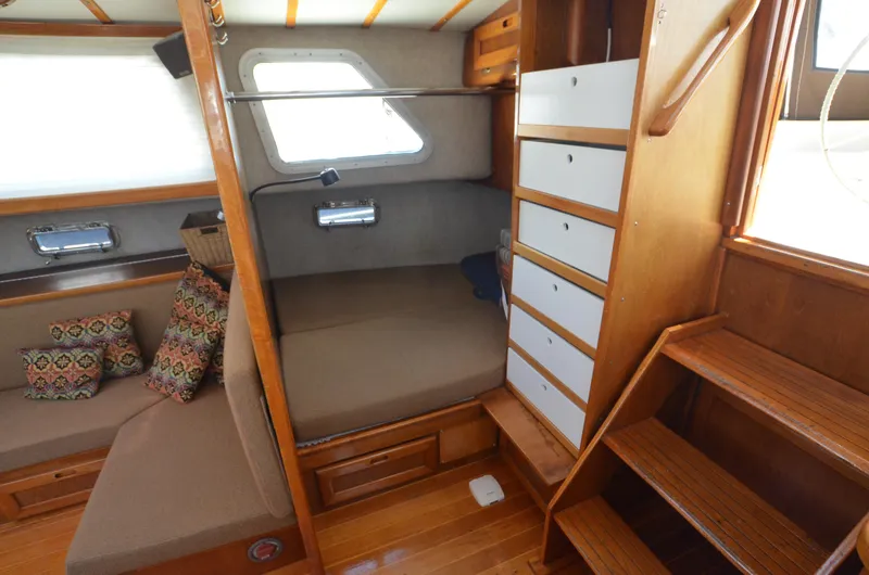 Slide: The Image of Cozy interior of 1980 Cooper 416 Pilothouse with wooden furnishings and seating area. - 25