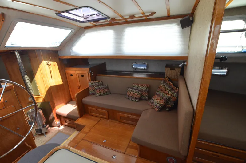 Slide: The Image of Interior of 1980 Cooper 416 Pilothouse with cozy seating and wooden cabinetry. - 33