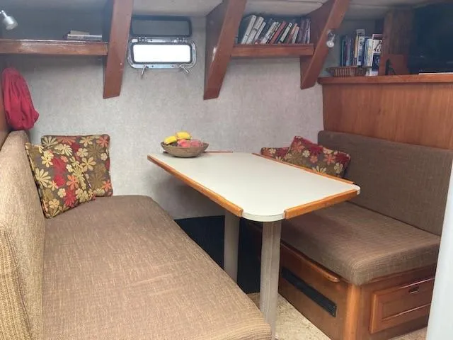 Slide: The Image of Cozy interior of 1980 Cooper 416 Pilothouse with dining area and bookshelves. - 35