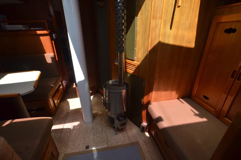 Slide: The Image of Interior of 1980 Cooper 416 Pilothouse with wood paneling and seating area. - 36