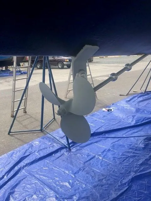 Slide: The Image of Propeller of 1980 Cooper 416 Pilothouse on blue tarp during maintenance. - 46