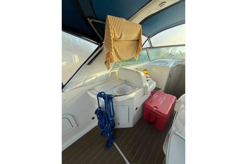 Slide: The Image of Interior of 1996 Sea Ray Sundancer 330 boat with cooler and ropes. - 7