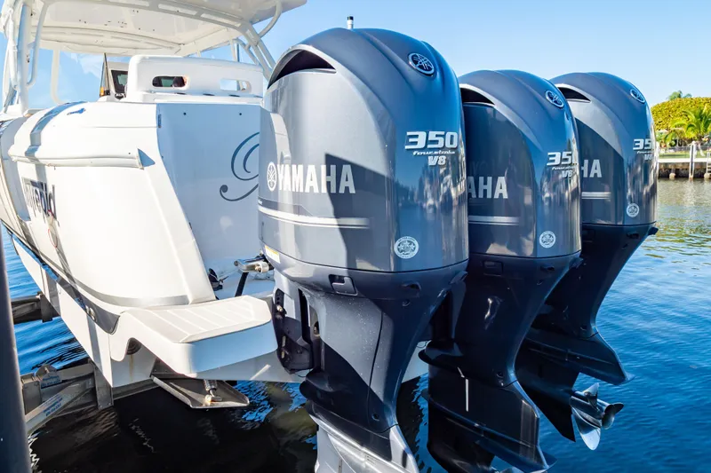 Slide: The Image of 2016 Intrepid 400 Cuddy with triple Yamaha 350 V8 engines on water. - 11