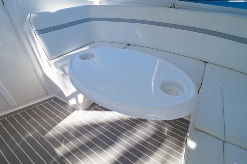 Slide: The Image of Interior of 2016 Intrepid 400 Cuddy with white seating and oval table. - 113