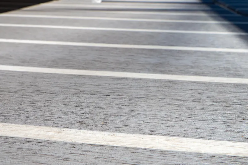 Slide: The Image of Teak deck of 2016 Intrepid 400 Cuddy boat, showcasing elegant wood grain and craftsmanship. - 125