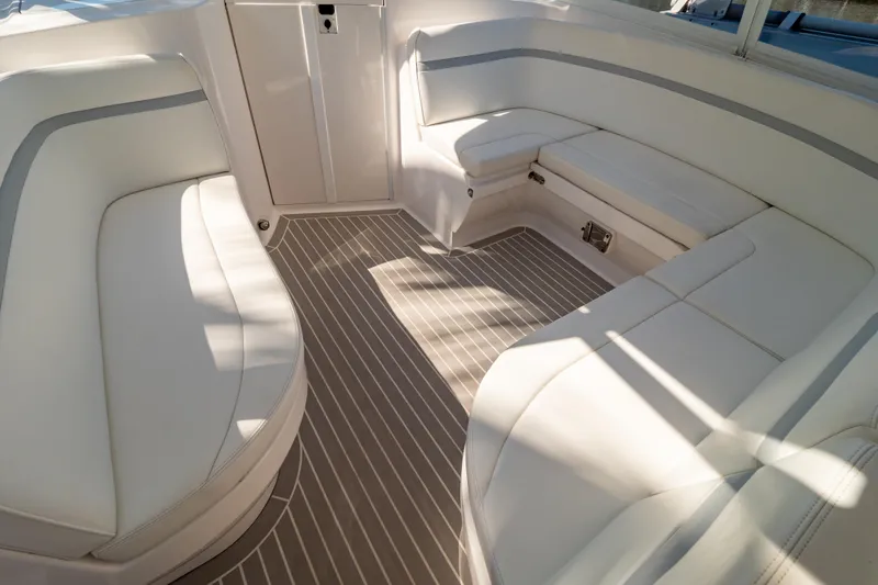 Slide: The Image of Luxurious seating area on a 2016 Intrepid 400 Cuddy boat interior. - 127