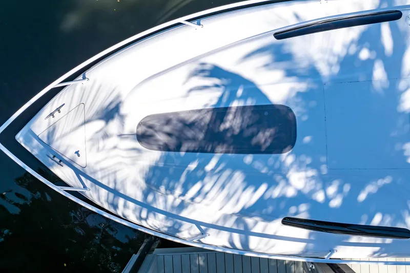 Slide: The Image of Overhead view of 2016 Intrepid 400 Cuddy boat with palm shadows on deck. - 135