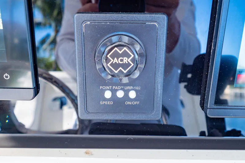 Slide: The Image of Control panel of a 2016 Intrepid 400 Cuddy boat with ACR Point Pad URP-102. - 21