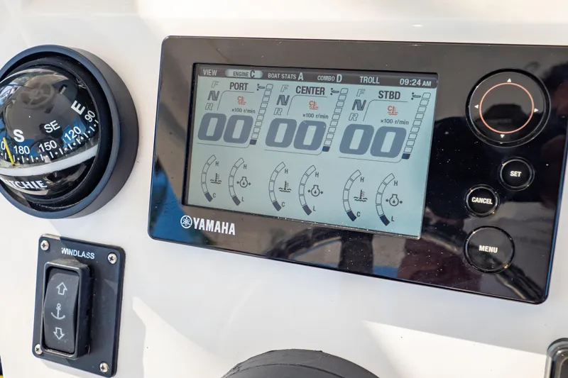 Slide: The Image of Yamaha control panel on 2016 Intrepid 400 Cuddy boat, featuring compass and windlass switch. - 25