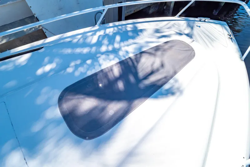 Slide: The Image of 2016 Intrepid 400 Cuddy boat deck with shadows and railing. - 28
