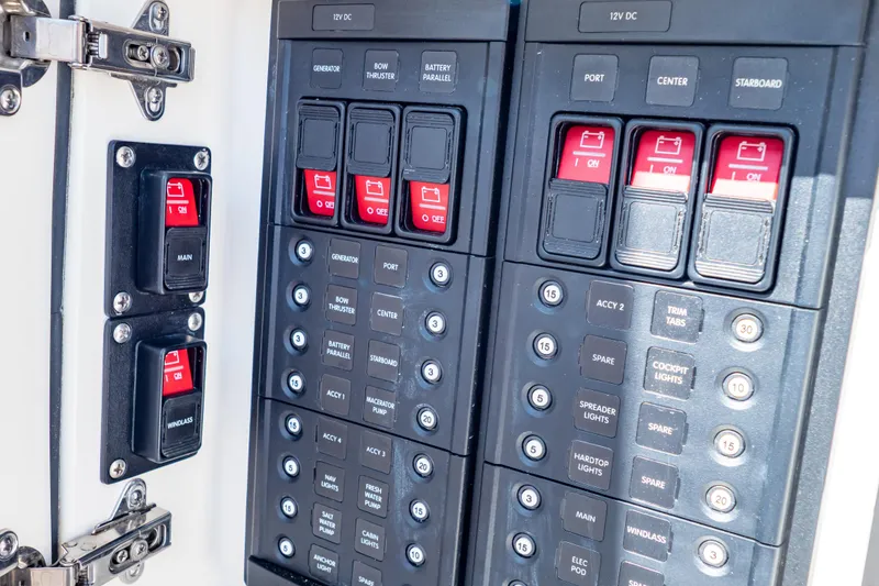 Slide: The Image of Electrical panel of a 2016 Intrepid 400 Cuddy boat with labeled switches and controls. - 33