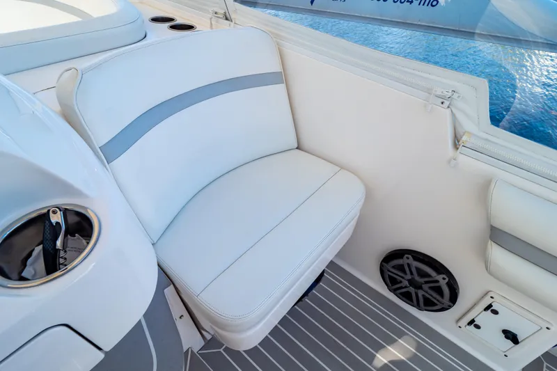 Slide: The Image of White seating area on 2016 Intrepid 400 Cuddy boat with cup holder and speaker. - 37