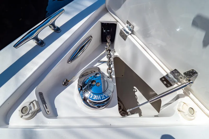 Slide: The Image of Anchor compartment of 2016 Intrepid 400 Cuddy boat with polished metal fittings. - 38