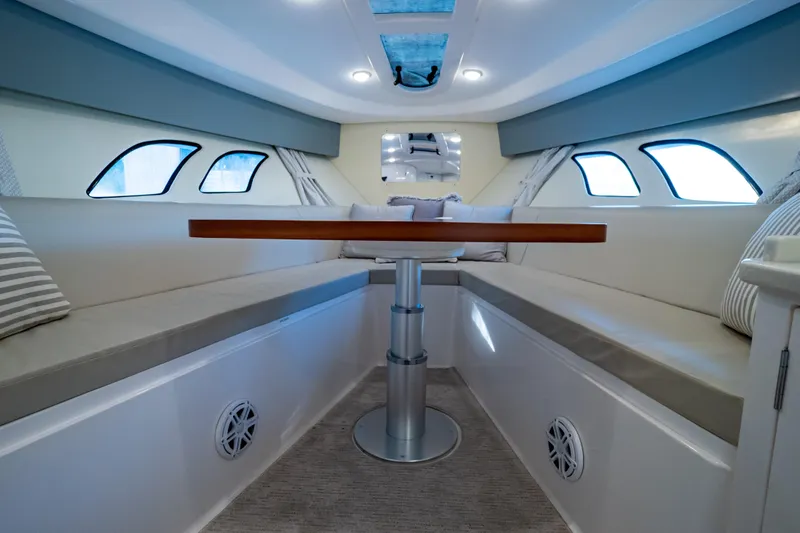 Slide: The Image of Luxurious interior of 2016 Intrepid 400 Cuddy boat with seating and table. - 39